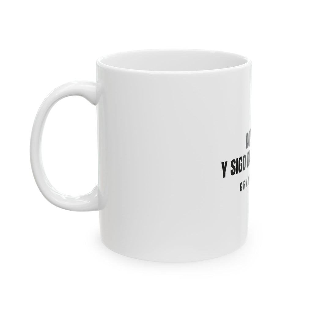 Aquí Sigo. Y Sigo Dando Guerra White Mug — Gray Out Loud (Spanish)