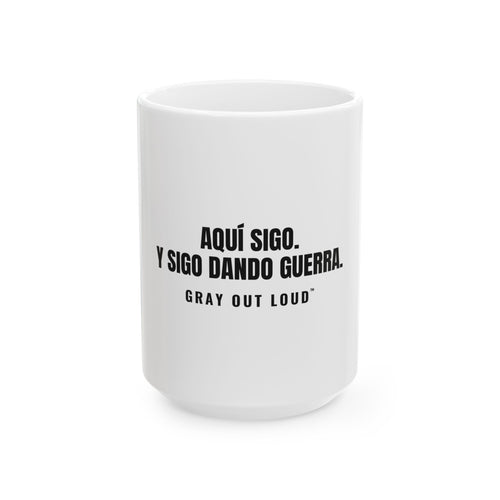 Aquí Sigo. Y Sigo Dando Guerra White Mug — Gray Out Loud (Spanish)