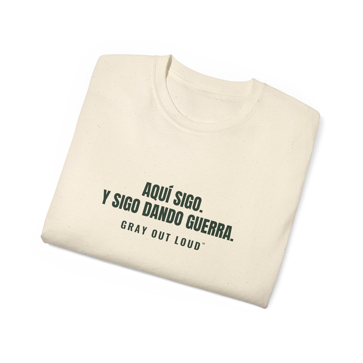Aquí Sigo. Y Sigo Dando Guerra Tee — Gray Out Loud (Spanish)