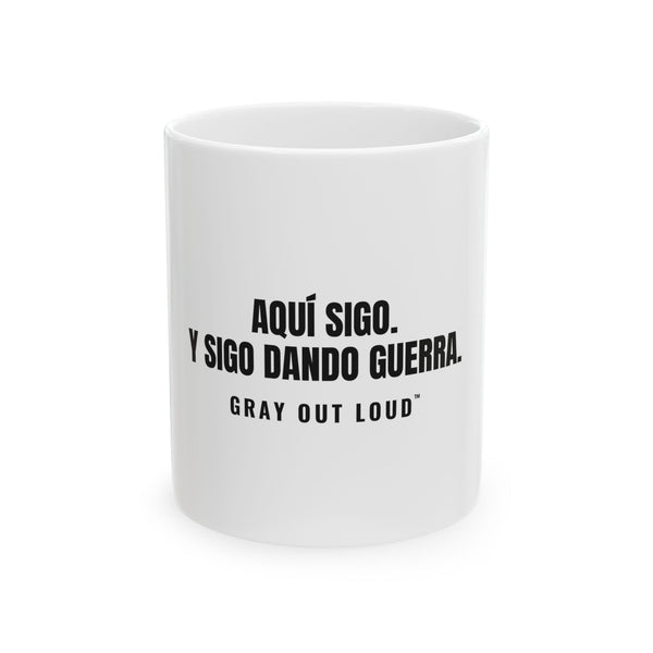 Aquí Sigo. Y Sigo Dando Guerra White Mug — Gray Out Loud (Spanish)