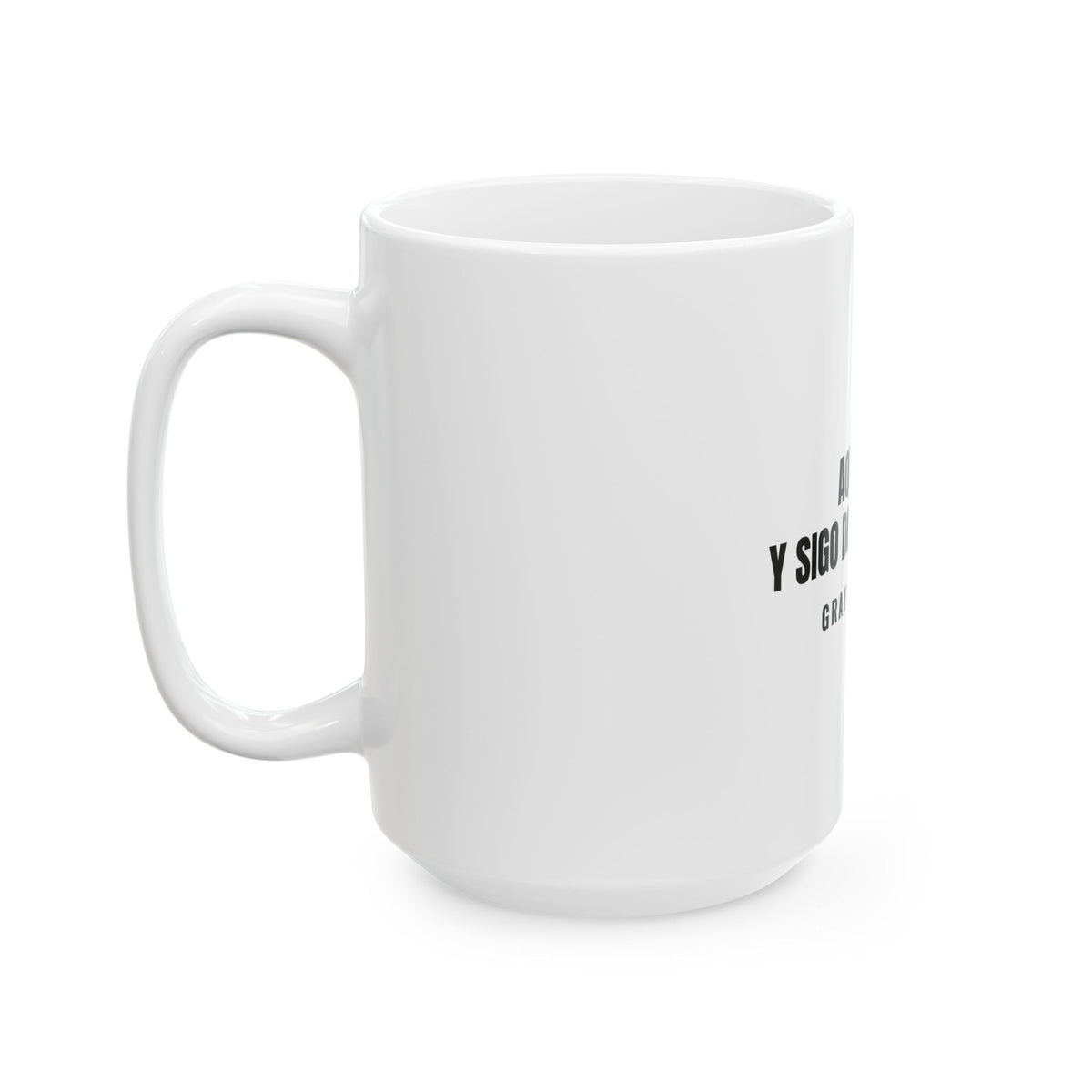 Aquí Sigo. Y Sigo Dando Guerra White Mug — Gray Out Loud (Spanish)